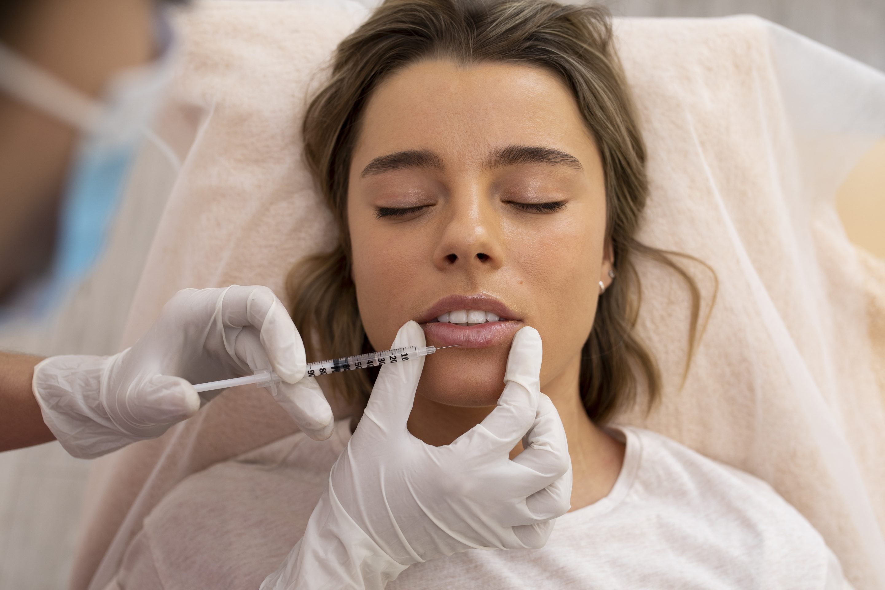 close-up-young-woman-getting-lip-filler