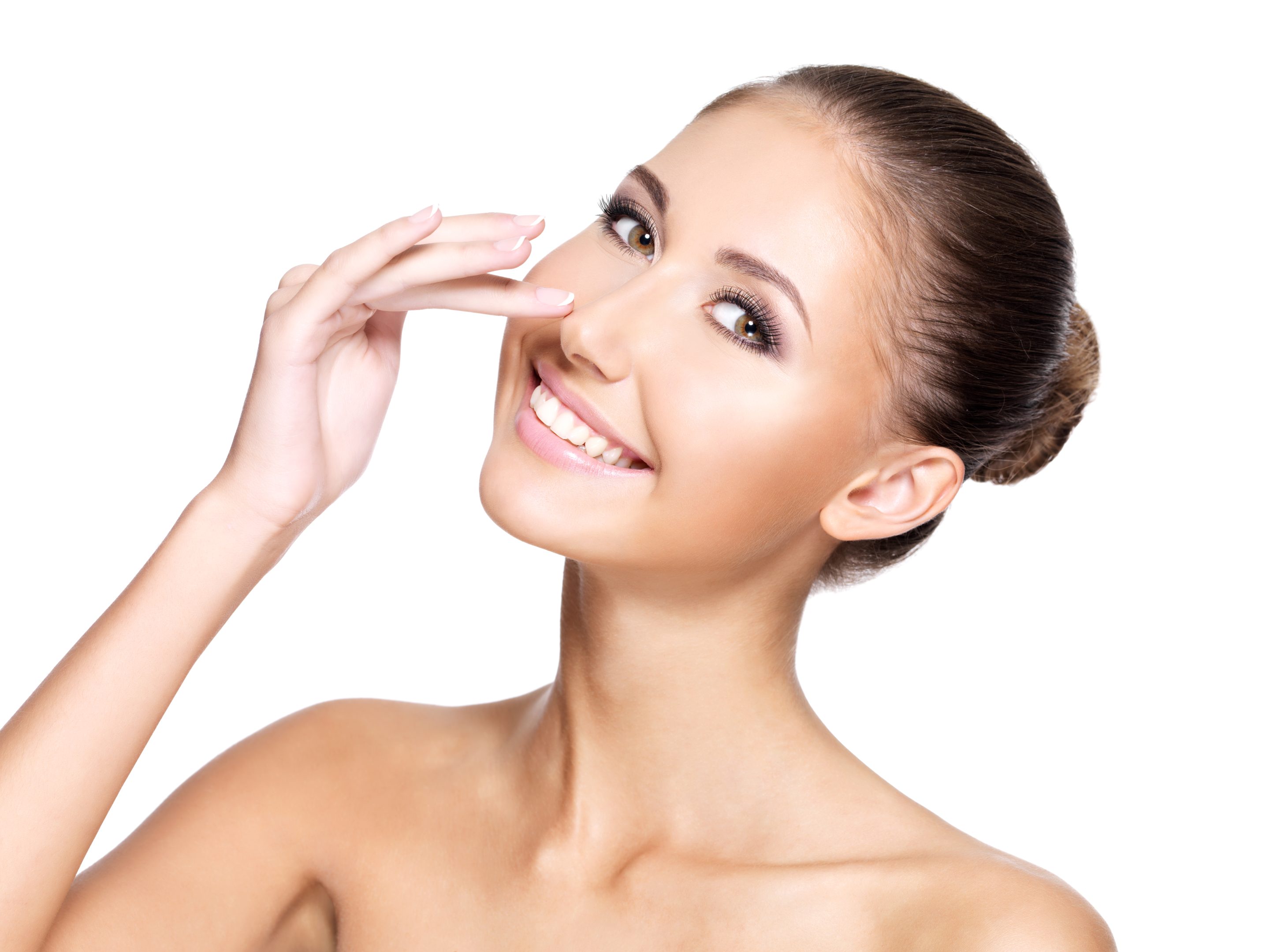 Portrait of a beautiful young woman with perfect skin touching h